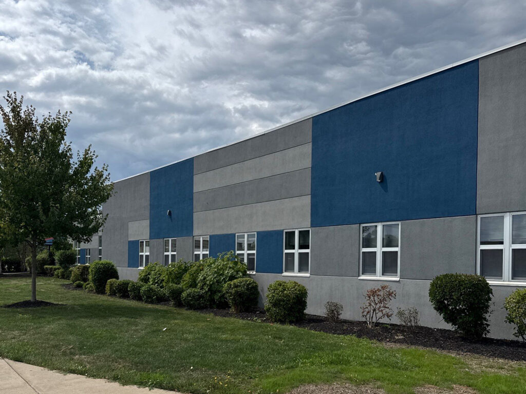 Modern industrial building with blue and grey facade