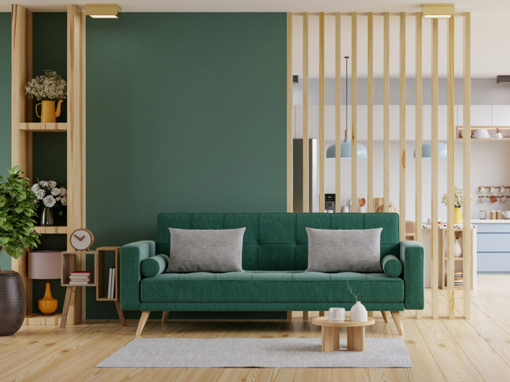 Modern living room with green sofa and wooden accents