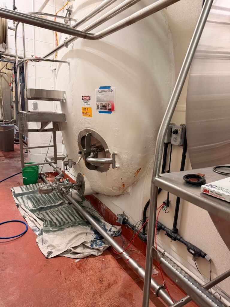 Industrial fermentation tank with piping and control systems