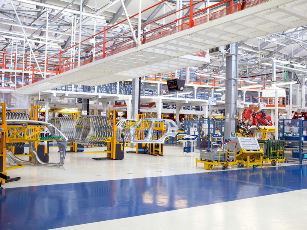 Modern automotive assembly line in a spacious factory setting