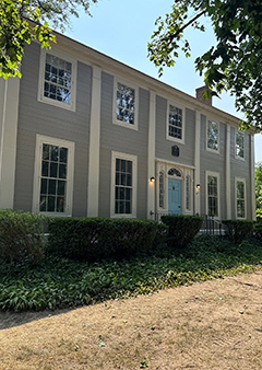 Charming two-story colonial house with blue door